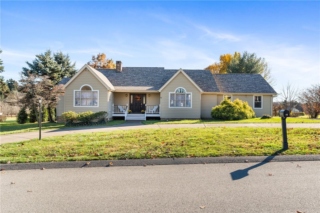 single story home featuring a front yard and a porch