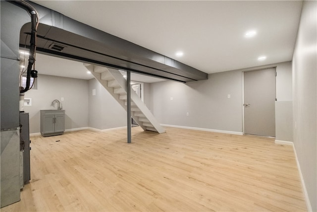 basement with light wood-type flooring