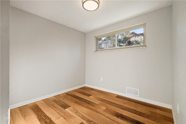 spare room featuring hardwood / wood-style flooring