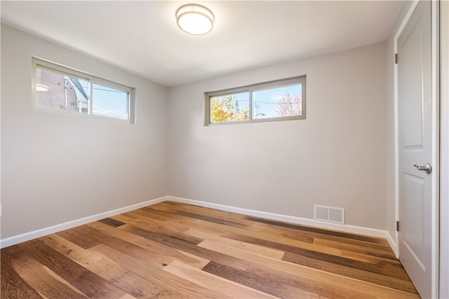 empty room featuring wood-type flooring