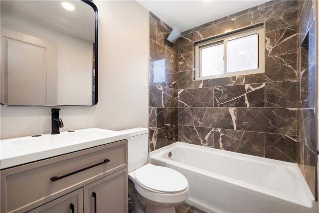 full bathroom with vanity, toilet, and tiled shower / bath