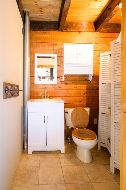 bathroom featuring tile patterned flooring, wooden walls, beam ceiling, and wood ceiling