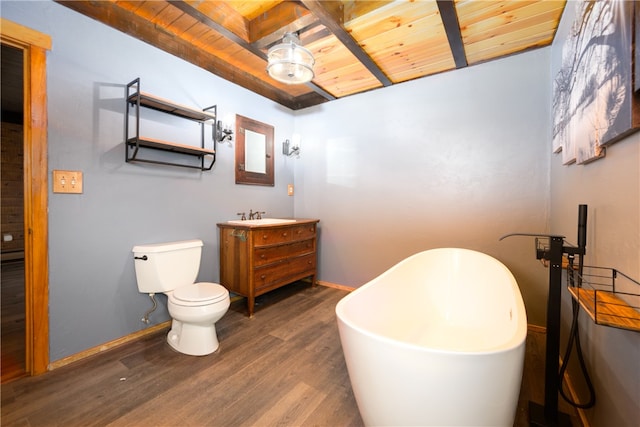 bathroom with vanity, a tub, wood ceiling, hardwood / wood-style floors, and toilet