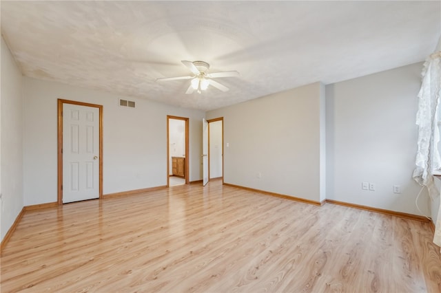 unfurnished room with ceiling fan and light wood-type flooring