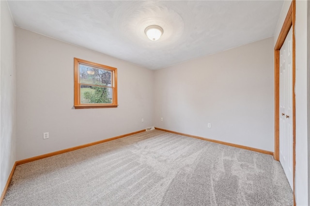 unfurnished bedroom with carpet floors and a closet