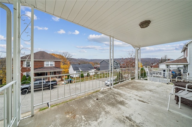 view of patio featuring a mountain view and a porch