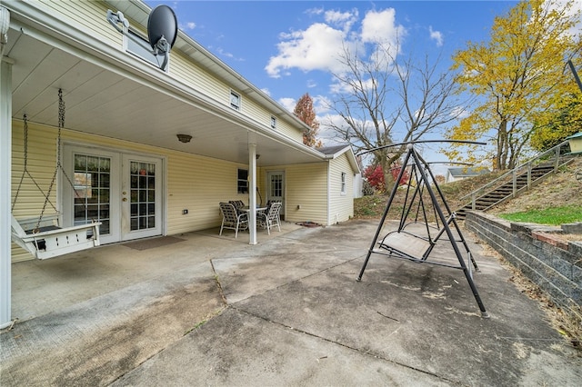 view of patio / terrace featuring stairs