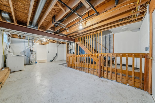 basement with washer / clothes dryer and water heater