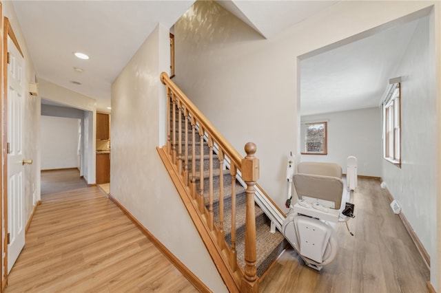 stairs with hardwood / wood-style floors