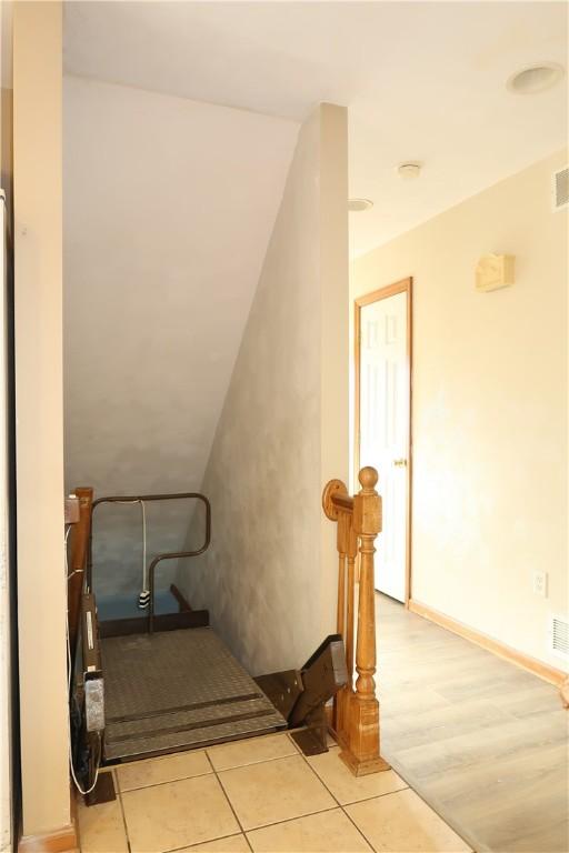 staircase featuring hardwood / wood-style floors