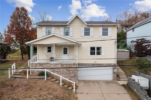 view of front of house with a garage and a porch