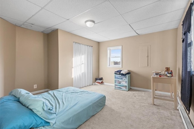 carpeted bedroom featuring a paneled ceiling