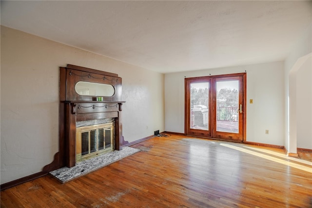 unfurnished living room with light wood-type flooring