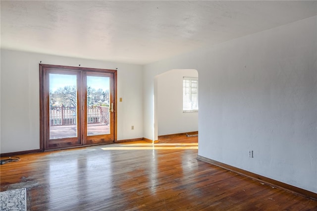 spare room featuring hardwood / wood-style floors