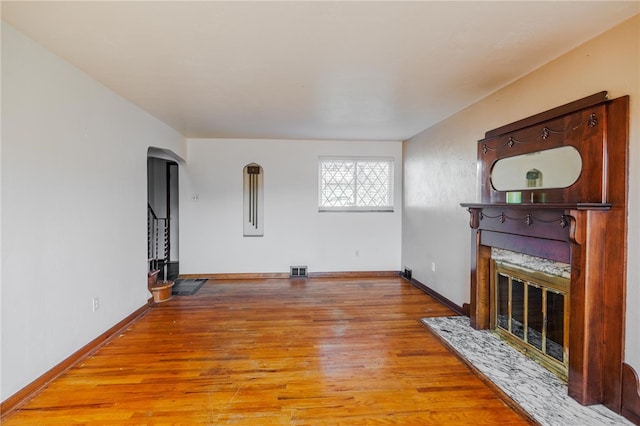 unfurnished living room with light hardwood / wood-style flooring