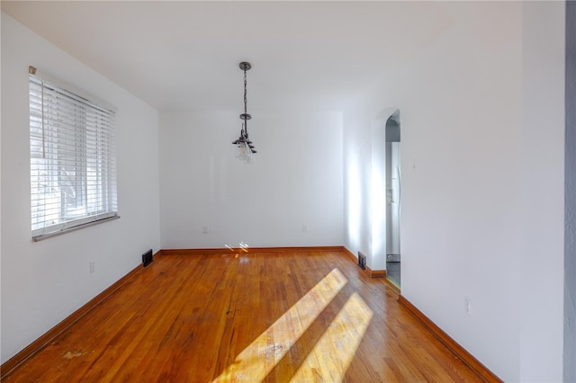 unfurnished room featuring light wood-type flooring