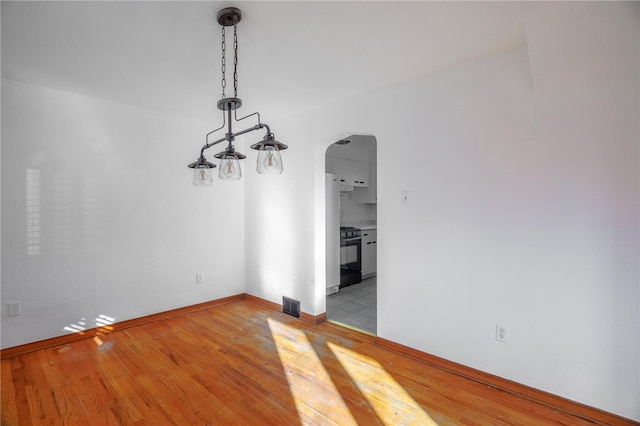 unfurnished dining area featuring light hardwood / wood-style flooring