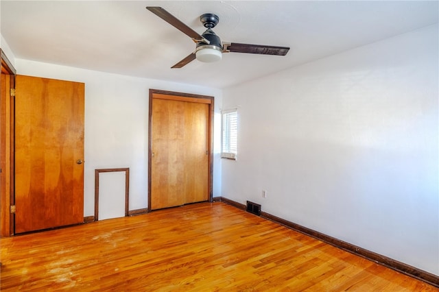 unfurnished bedroom with ceiling fan and light hardwood / wood-style flooring