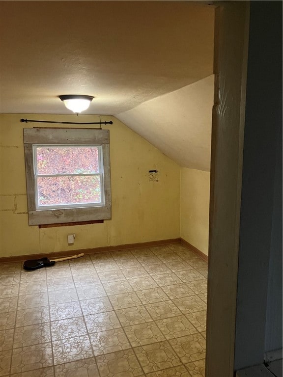 bonus room featuring vaulted ceiling