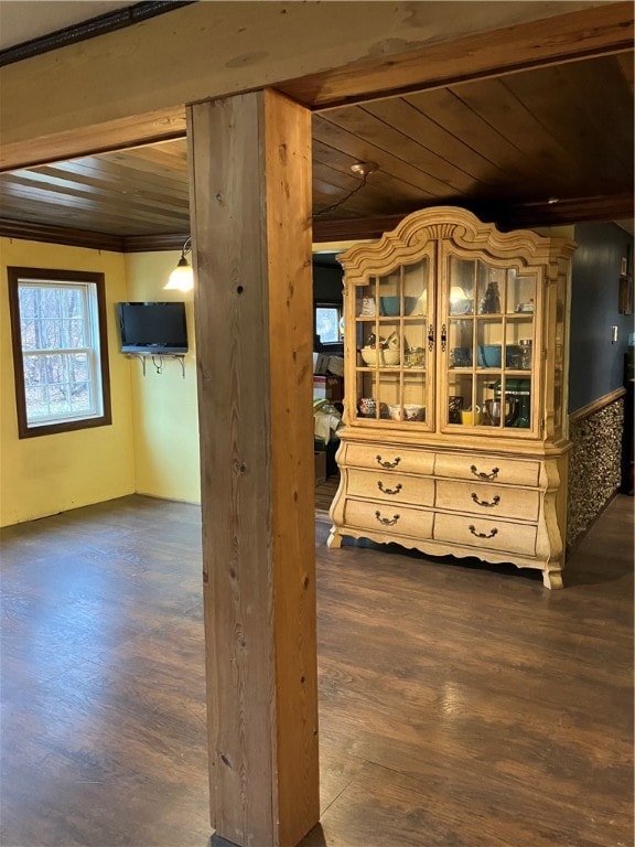 interior space featuring wood-type flooring, crown molding, and wood ceiling