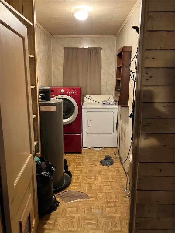 laundry area featuring washer and clothes dryer and light parquet flooring