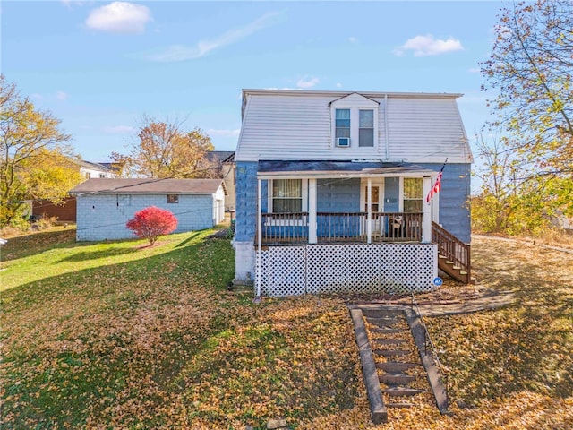 bungalow-style house featuring a porch and a front lawn