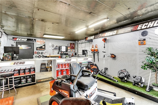 interior space with concrete flooring and a workshop area