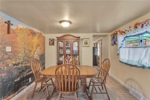 dining room featuring hardwood / wood-style flooring