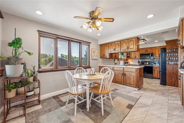 dining room featuring ceiling fan