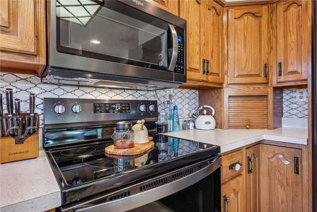 kitchen with tasteful backsplash and stainless steel appliances