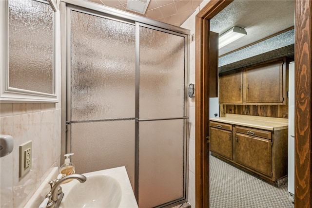 bathroom featuring a shower with shower door