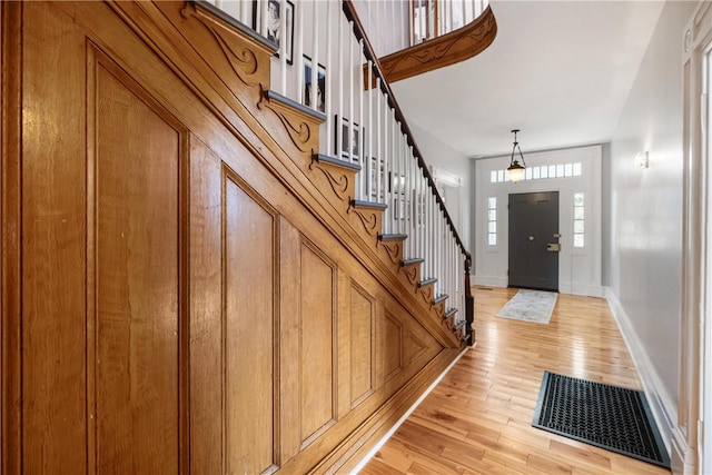 foyer entrance with light hardwood / wood-style floors