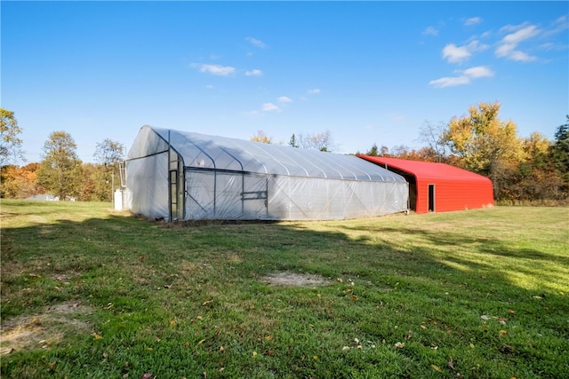 view of outdoor structure featuring a yard