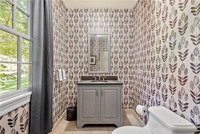 bathroom with vanity, tile patterned floors, and toilet