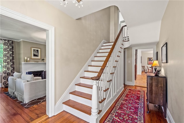 staircase featuring hardwood / wood-style flooring