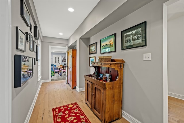 corridor featuring light hardwood / wood-style floors