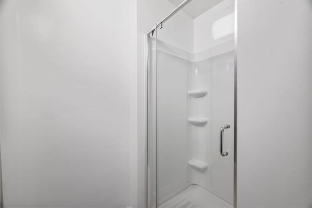 bathroom featuring walk in shower