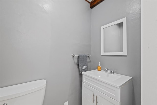 bathroom with toilet and vanity