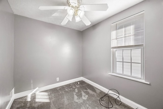 unfurnished room with ceiling fan, a textured ceiling, and carpet flooring