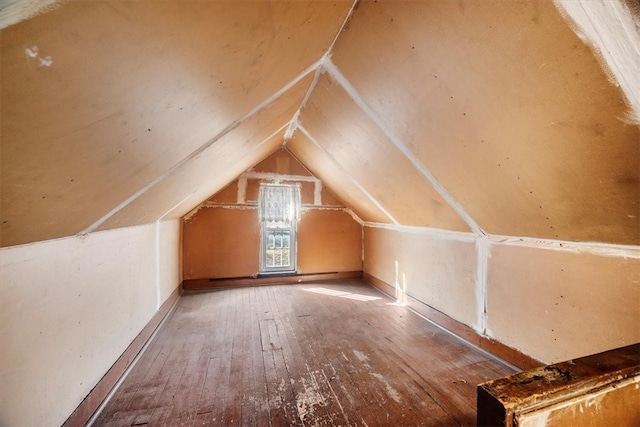 bonus room featuring wood-type flooring and vaulted ceiling