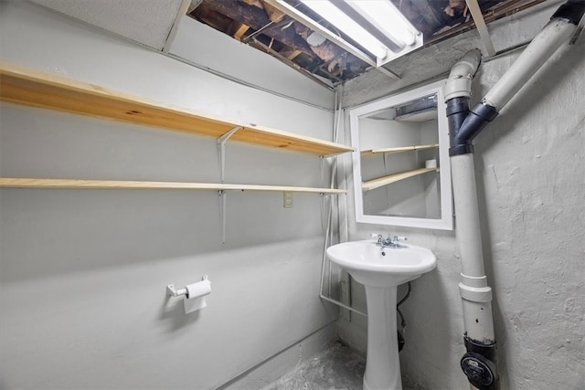 bathroom with concrete flooring