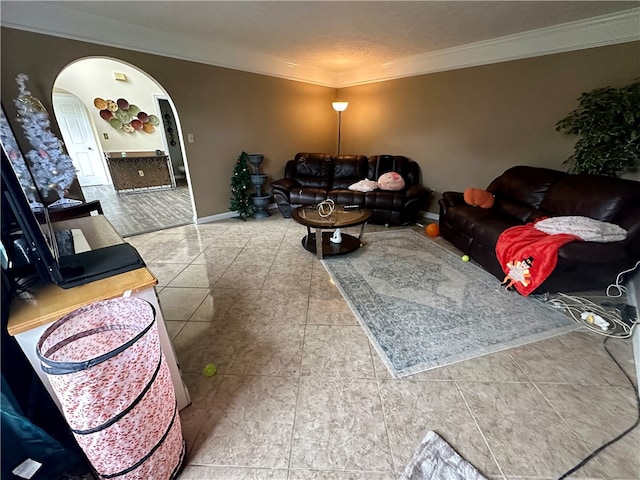 tiled living room with a textured ceiling and ornamental molding