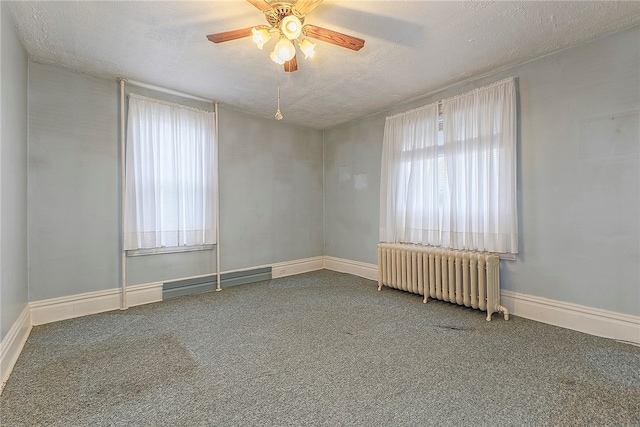 spare room with carpet, radiator heating unit, a textured ceiling, and ceiling fan