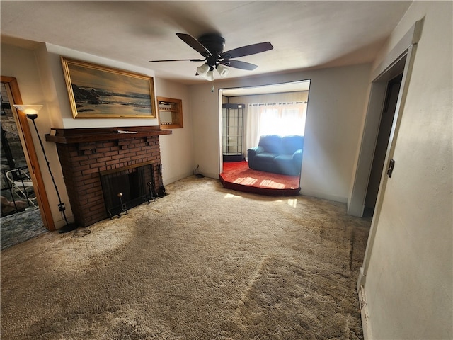 carpeted living room with ceiling fan and a brick fireplace