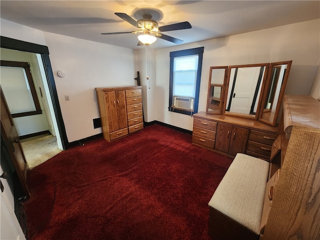 bedroom with cooling unit, dark colored carpet, and ceiling fan