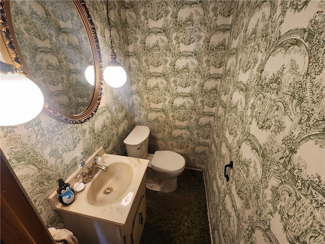 bathroom featuring vanity and toilet