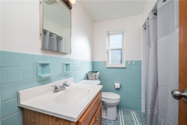 bathroom featuring tile patterned floors, toilet, tile walls, a shower with curtain, and vanity