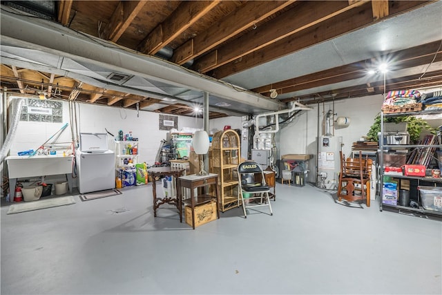 basement featuring water heater and sink