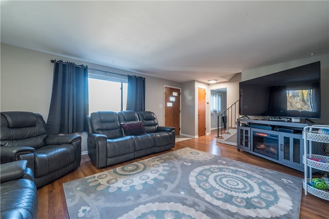 living room with a wealth of natural light and hardwood / wood-style floors