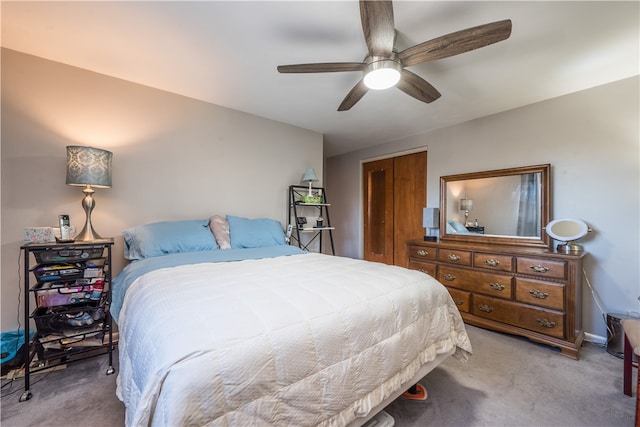 bedroom featuring a closet, carpet flooring, and ceiling fan